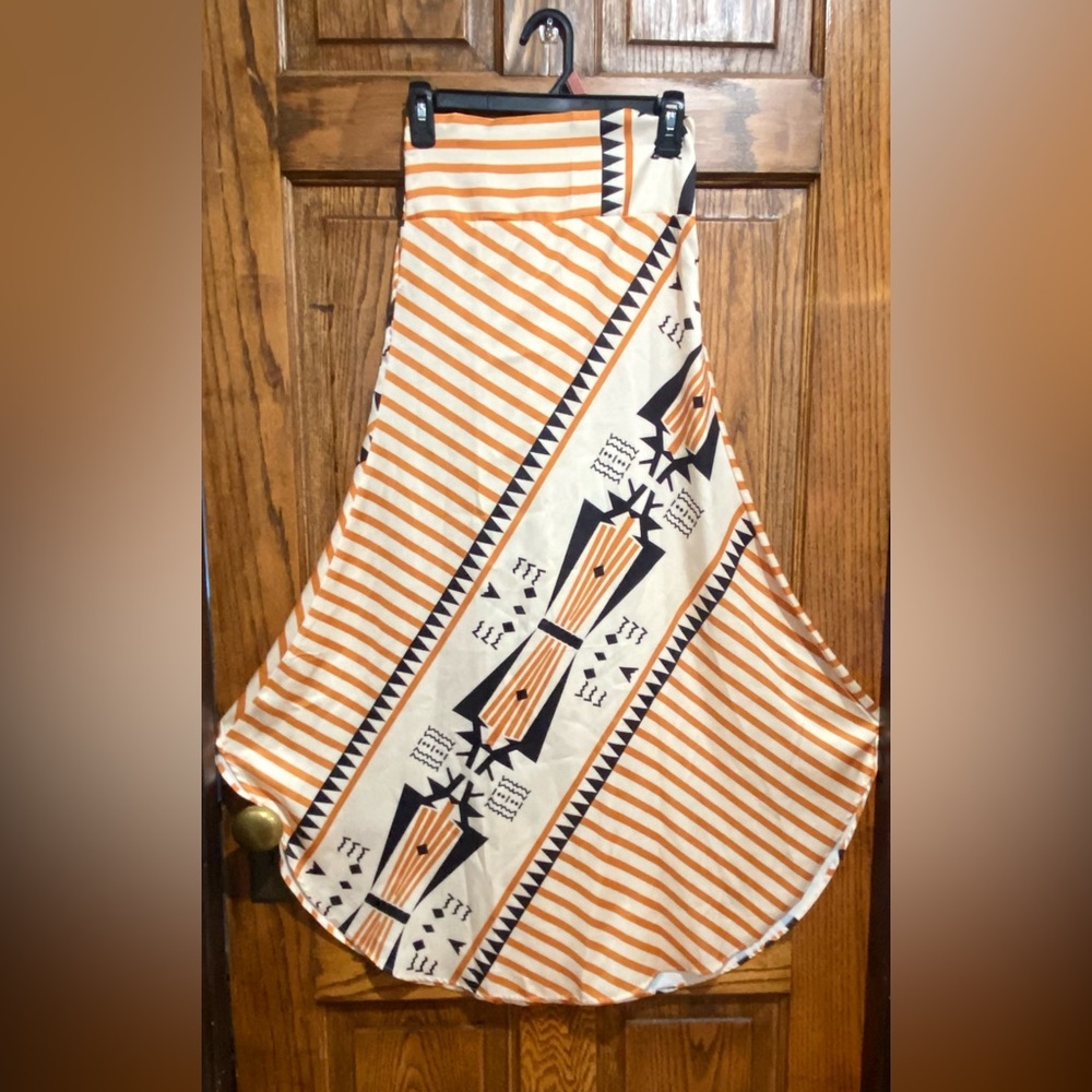 White, cream, and black skirt featuring a southwest inspired design.